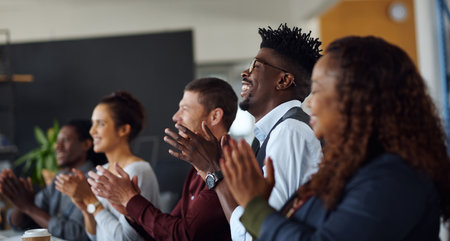 Theyre feeling deeply inspired after that talk. a group of businesspeople applauding during a presentation in an office.の写真素材