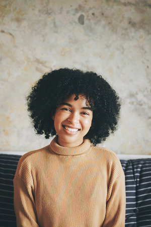 I actually prefer being home. Portrait of if a young woman relaxing on a sofa at home.