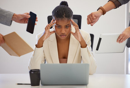 Business, stress and black woman with a laptop, multitasking and anxiety with deadline, burnout and headache. Female person, employee and consultant with a pc, frustrated and professional with chaosの写真素材