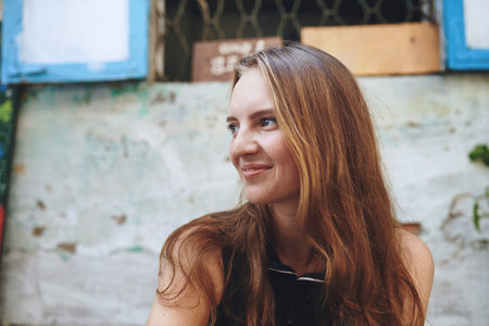 Think happy thoughts, always. a young woman sitting outside while exploring a foreign city.