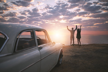Go where you feel most alive. a young couple making a stop at the beach while out on a road trip.