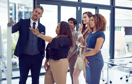 Tell me a little bit more about this...a group of businesspeople working on a whiteboard in the...