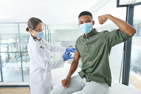 Im stronger than a tiny needle. an unrecognizable doctor giving a patient an injection in an office.