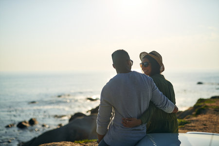 I would like to go on another date with you...a young couple making a stop at the beach while out on a roadtrip.の写真素材