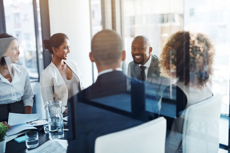 Behind a great business is a great team. a team of professionals having a meeting in the boardroom...