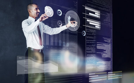 Touching the future. a handsome young businessman using a digital interface.