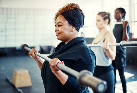 Heres to becoming a better person I was yesterday. a fitness group using steel bars in their session...