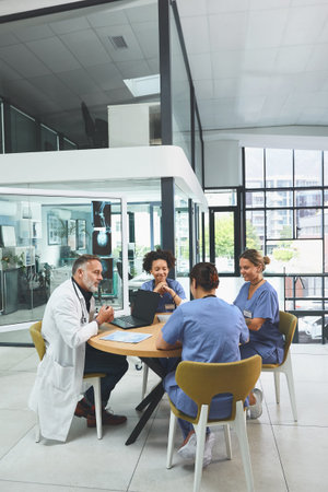 Sharing their insights with each other. a team of doctors having a meeting in a hospital.