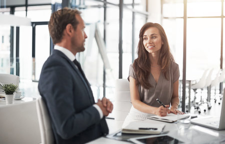 It takes passion and dedication to keep business moving forward. two businesspeople having a...