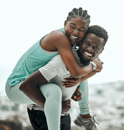 Black people, piggyback and couple hiking outdoor with smile and fitness in portrait. Excited, travel and workout together with trekking, man with woman and happiness in relationship with exerciseの写真素材