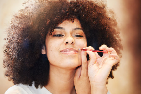 Grooming, tweezers and woman doing beauty self care, skincare and removal of hair cleaning her face in the morning. Facial, wellness and young female person doing cosmetics dermatology treatmentの写真素材