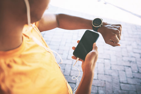 The smart app that gets you sweating. a man pairing his watch with a smartphone during a workout...