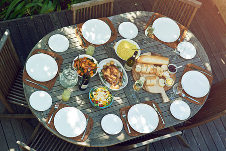 Sunday roast out in the garden. an outdoor lunch on a table.の写真素材