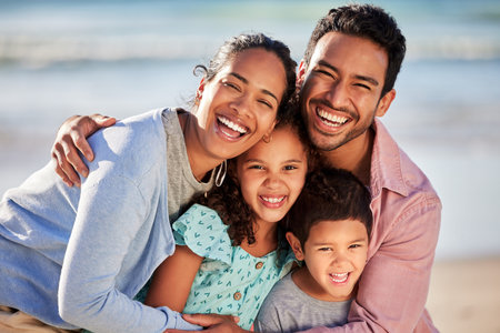 I cant imagine life without the people I love. Shot of a young couple and their two children spending the day together at the beach.