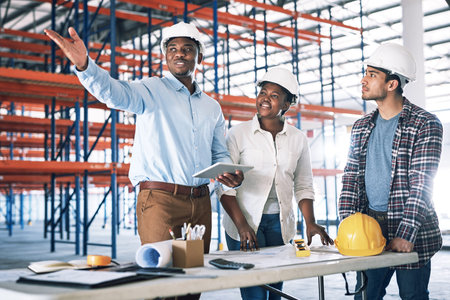 Your vision is their mission. a group of builders having a meeting at a construction site.