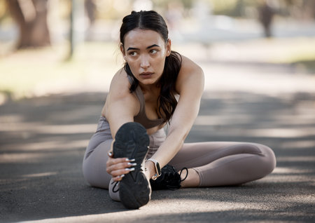 Stretching, fitness and running with woman in road and training for cardio, workout and exercise....