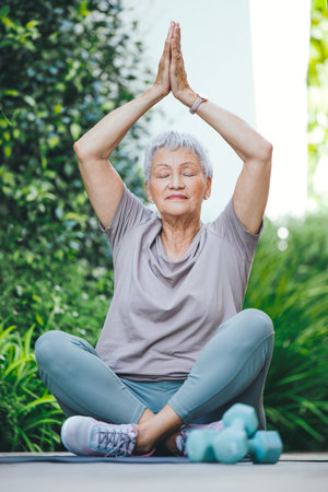 Youre never too old to find yourself. an older woman in deep meditation outside.の写真素材