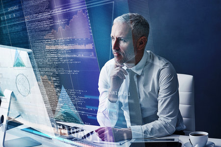 Its still not 100 there...a mature businessman working on programming code.の写真素材