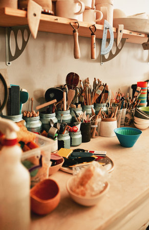 Tools of the trade. Closeup shot of work tools in a pottery workshop.の写真素材