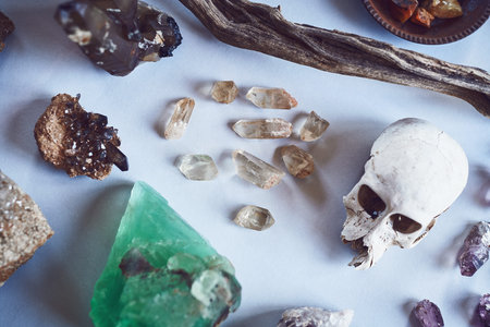 We even have small ones. High angle shot of a table filled with different types of crystals and a...