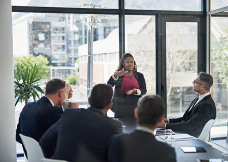 Presentation, leadership with woman and colleagues in a business meeting in a boardroom of their...