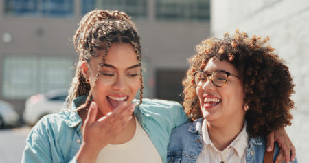 Women, lesbian couple walking and laughing in city, bonding and hugging together on street. Girls,...