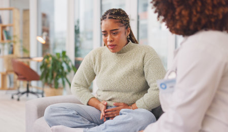 Advice, psychology and mental health with woman on sofa for counseling, depression and therapy. Healthcare, consulting and support with doctor and patient for problem, conversation and rehabilitationの写真素材