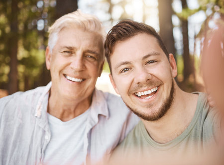 Happy man, selfie or senior father in woods or nature for family memory or bonding with smile, care...