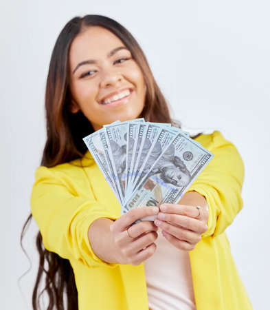 Money, studio portrait or happy woman, business trader or person show cash dollar prize, competition win or giveaway. Winner, pay or corporate agent face with 401k, wealth or rich on white backgroundの写真素材