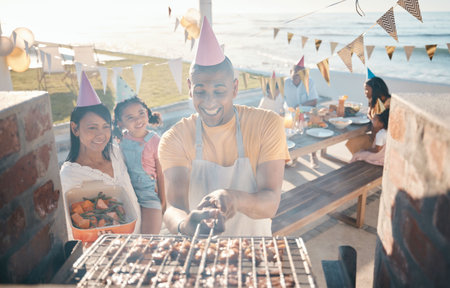 Help, birthday and family at barbecue party, lunch and summer in nature together. Camping, smile and woman helping a man with food on the grill, cooking bbq and meat on vacation by the sea for dinnerの写真素材