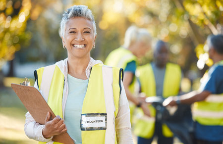 Clipboard, volunteering portrait and woman in park cleaning, community service and pollution or...