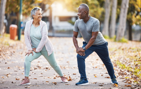 Exercise, stretching and senior couple in park for healthy body, wellness and workout outdoors....