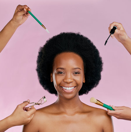 Portrait, smile and black woman with cosmetic tools, dermatology or happiness against a studio background. Face, female person or model with makeup, brushes or salon treatment with luxury or skincareの写真素材