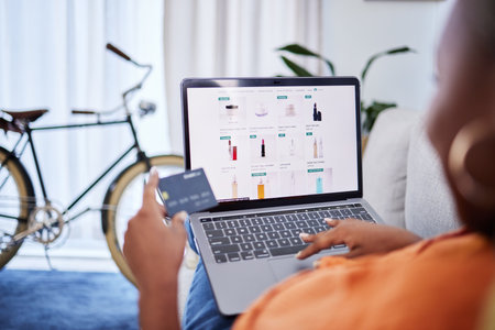 Laptop, beauty or woman online shopping with credit card for makeup cosmetics or digital product at home. Discount code, screen or girl with financial payment to buy skincare on fintech applicationの写真素材