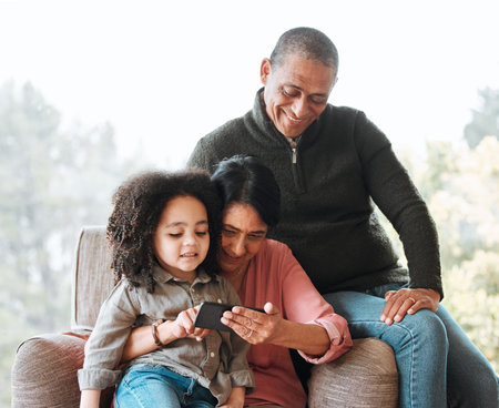 Grandparents, happy family and relax kid with cellphone for subscription movie, online gaming or...