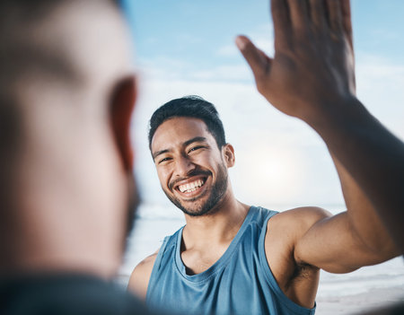 Happy man, fitness and high five for success, partnership or victory in achievement after workout in...