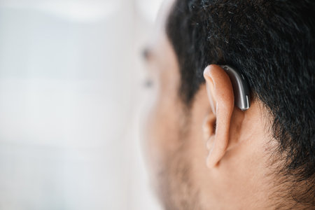 Hearing aid, closeup or ear of man with disability from the back on mockup space. Deaf person, medical device or implant of sound waves, audiology or help of listening equipment, accessory or supportの写真素材
