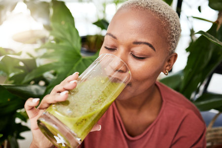 Black woman, diet and smoothie drink for vitamins, fiber or health and wellness in eco friendly...