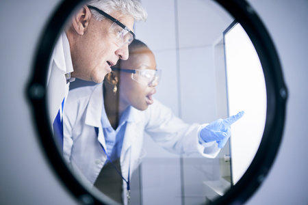 Science, shock and team scientists in lab working on futuristic experiment, research or test....