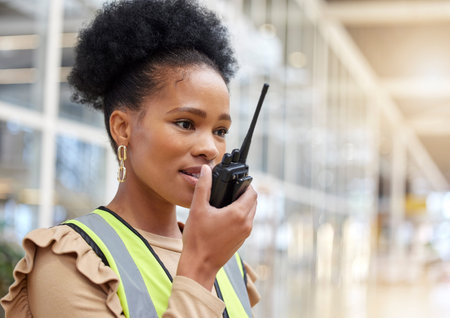 Walkie talkie, black woman and engineer talking for communication, construction and listening....