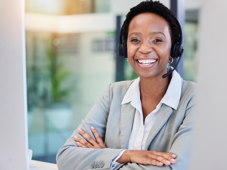 Black woman, smile or desk in call center for customer support, contact and advice at computer. Happy person and agent at telemarketing company for sales consulting or professional telecom serviceの写真素材