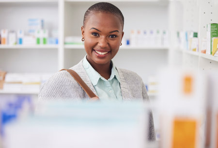 Medicine, portrait and shopping with black woman in pharmacy for medical, pills and information. Healthcare, product and retail with female customer and box for inventory, wellness and supplementsの写真素材
