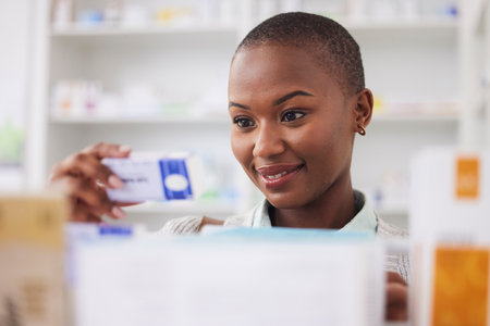 Medicine, pills and shopping with black woman in pharmacy for medical, search and information. Healthcare, product and retail with female customer and box for inventory, wellness and supplementsの写真素材
