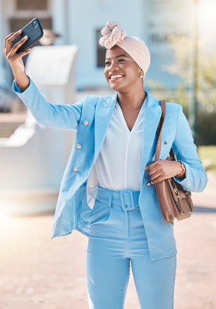 Black business woman, selfie and smile in street with fashion, beauty and post for social network app. Happy African entrepreneur, photography and profile picture for web blog with suit in metro cbdの写真素材