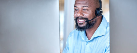 Call center, black man and communication at computer for customer service, CRM and contact us on...