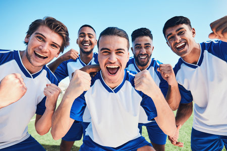 Soccer player, team portrait and celebration on field for winning, fist and together for training, goals or fitness. Athlete men, group and happy on pitch for exercise, football or success in contestの写真素材