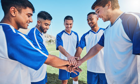 Fitness, circle and soccer team with their hands together for motivation, empowerment or unity. Sports, teamwork and group of athletes or football players in a huddle before game, match or tournamentの写真素材