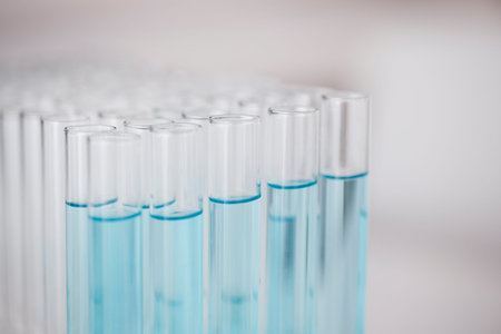 Test tube, blue chemical and closeup, chemistry and science study in lab, sample and medical...