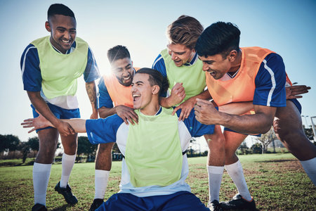 Football team, game and men celebrate together on a field for sports and fitness win. Happy male soccer player or athlete group for challenge, training or performance achievement outdoor on pitchの写真素材