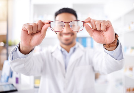 Hands, man and optometrist with glasses for vision, eyesight and prescription lens. Frame, ophthalmology and doctor with spectacles, eyewear for wellness and optician in store for medical healthcareの写真素材